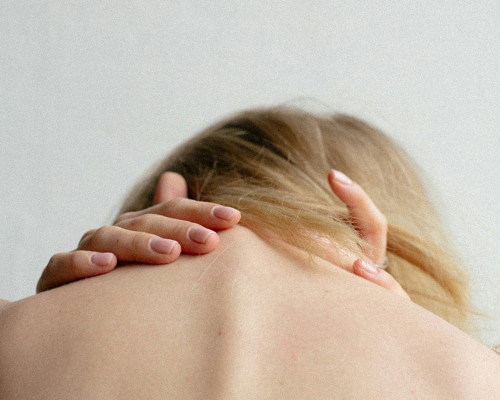 Active adult easing a burning ache between the shoulder blades in Lake Orion, MI
